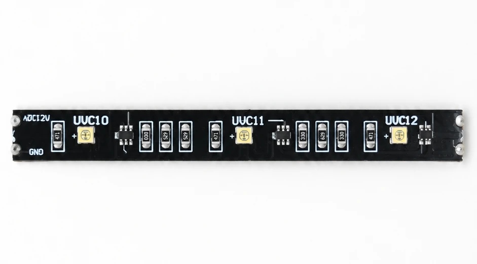 Studio presentation of a black flexible LED strip marked DC12V with numbered LED positions and on-strip components
