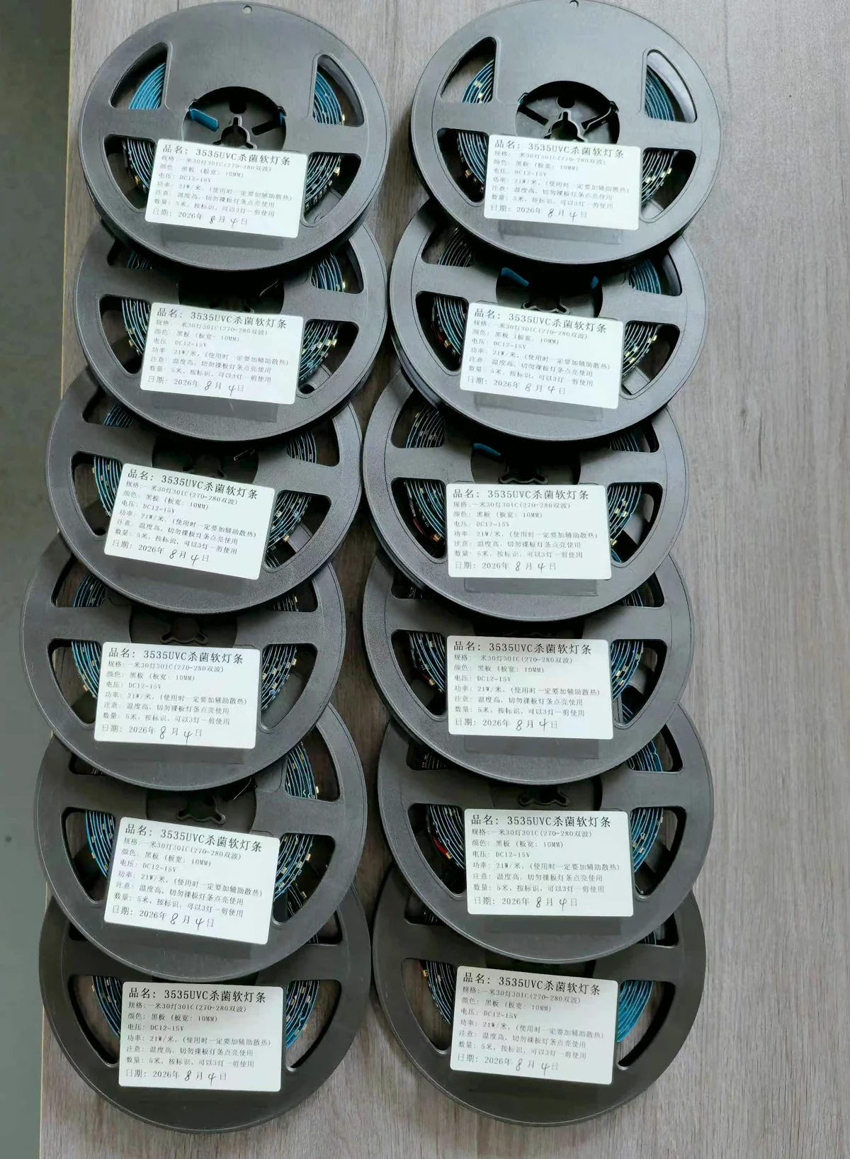 Multiple labeled reels of flexible UVC LED strip arranged in two columns