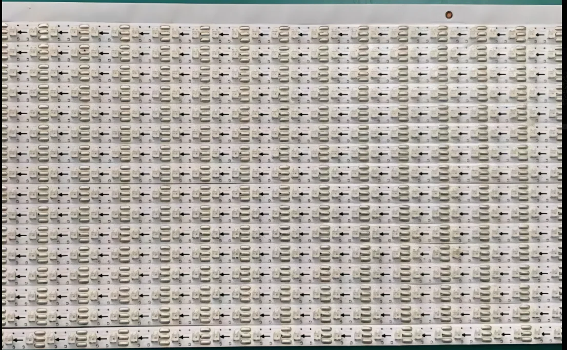Dense white LED module production panel showing repeated light-board geometry